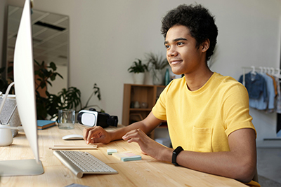 teen male working on a computer